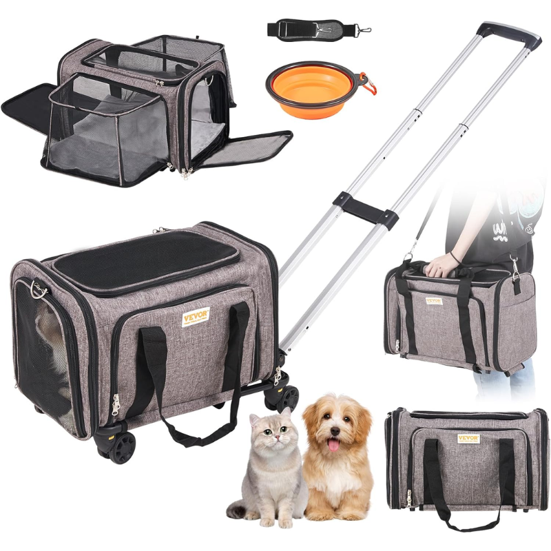 Grey rolling pet carrier with an orange collapsible bowl and black adjustable shoulder strap shown beside it