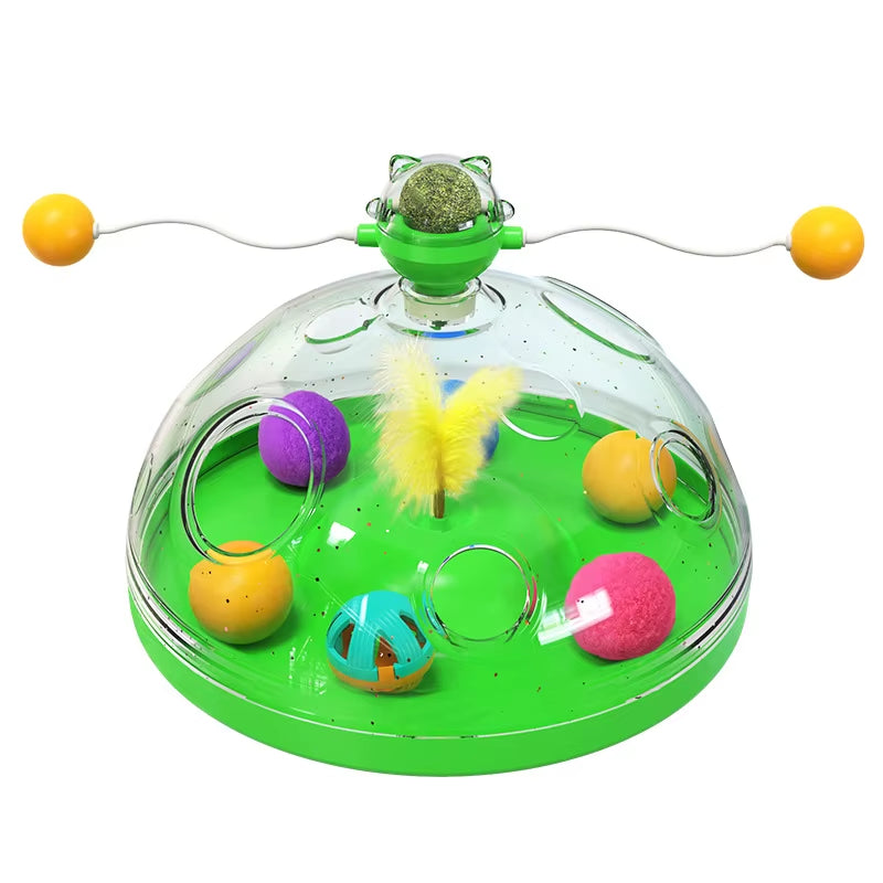 Green transparent dome cat toy with a spinning catnip ball, feather, and colorful balls inside