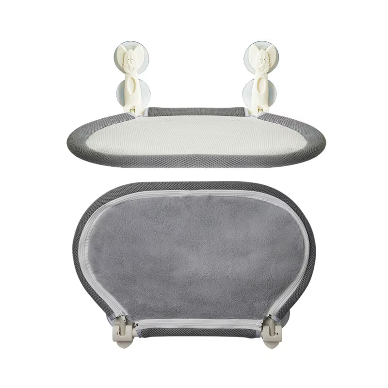 Grey mesh cat perch shown mounted at an angle on a window with a cat curled up on it