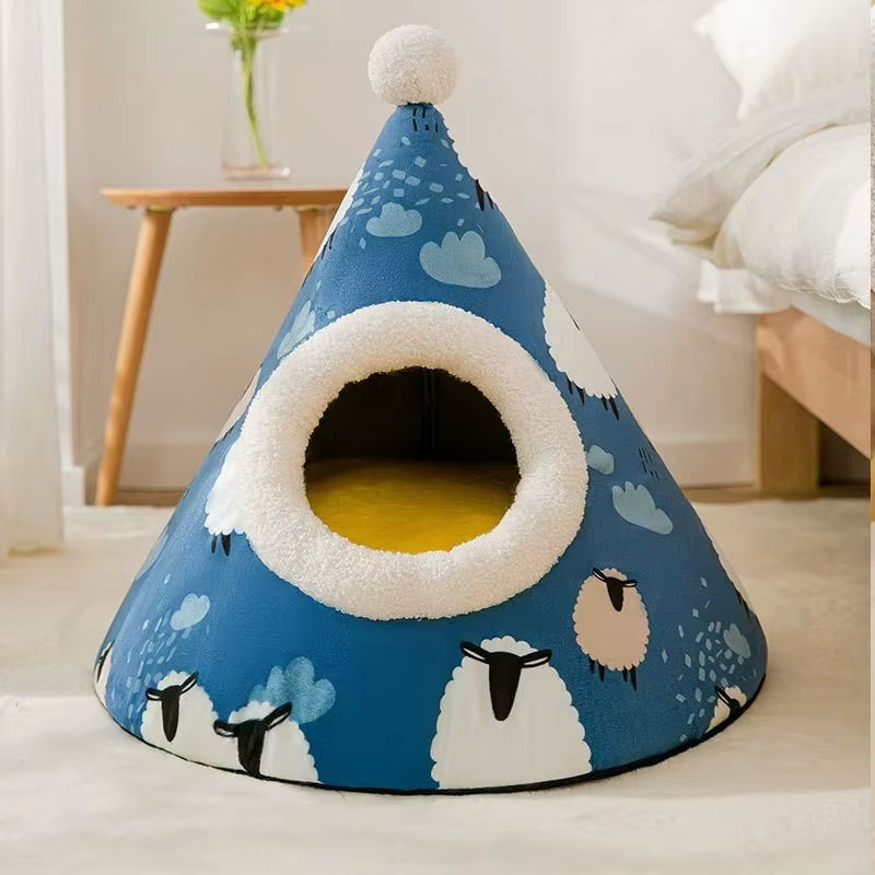 Blue cone-shaped pet tent printed with sheep and clouds and a white pompom on top