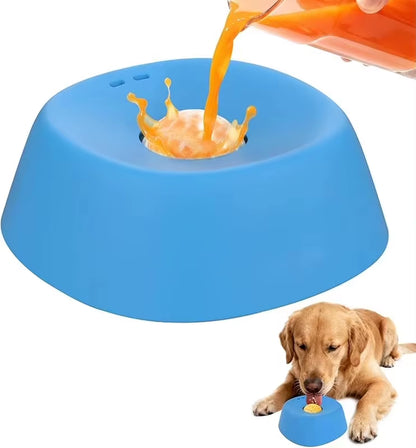 Orange liquid pouring into a blue slow feeder dog bowl beside a Golden Retriever waiting to lick from it