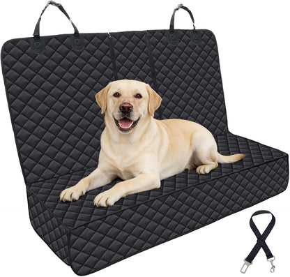 Yellow Labrador lying on a black quilted waterproof car seat cover with carry handles and a seatbelt tether