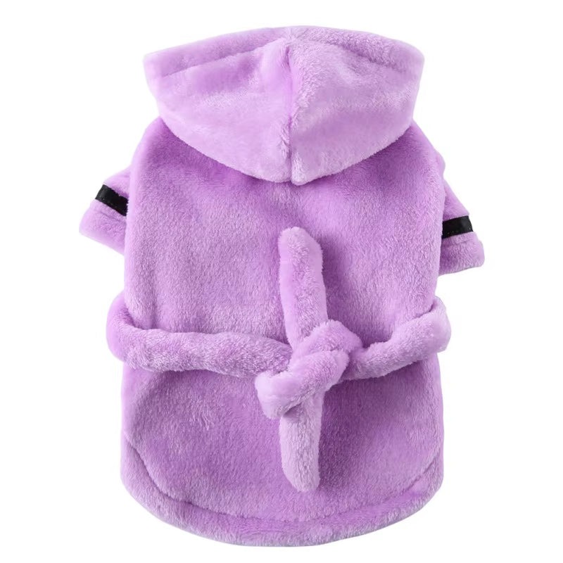 Hooded dog bathrobe photographed from above showing the full robe shape with hood and belt