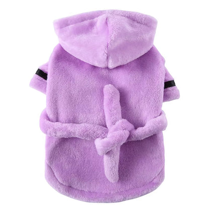 Hooded dog bathrobe photographed from above showing the full robe shape with hood and belt