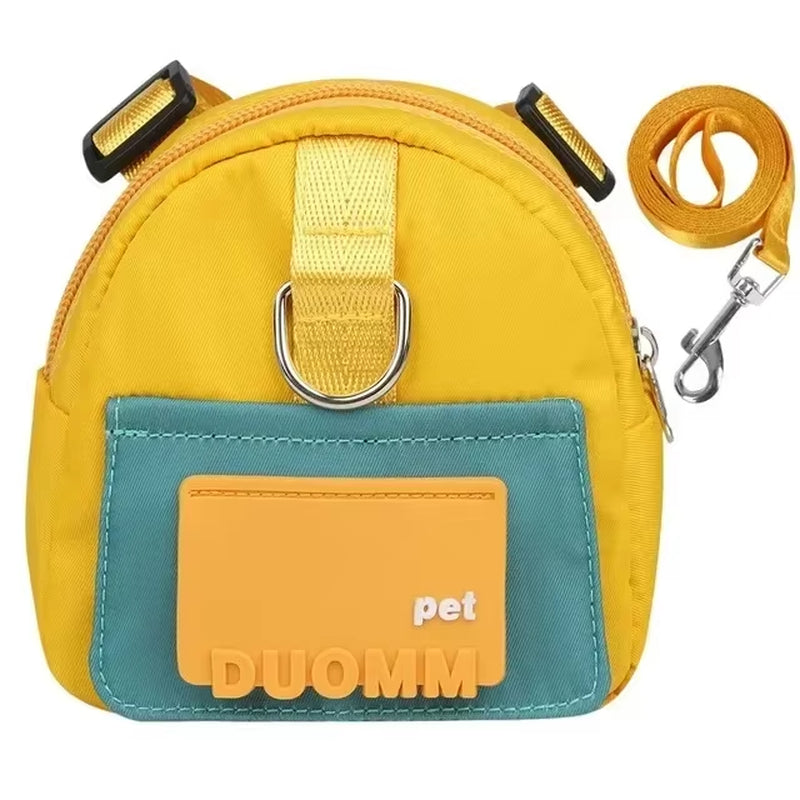 Yellow DUOMM dog backpack pouch laid flat showing its zipper, D-ring, and teal card holder pocket