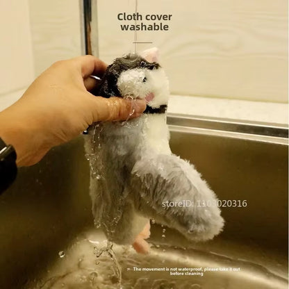 Hand rinsing the washable cloth cover of the FlutterChirp cat toy under a sink faucet before drying