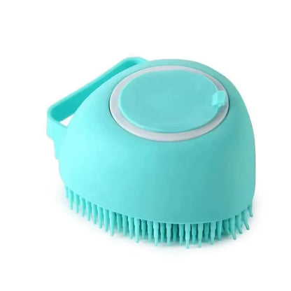 Close-up of the bath brush's thumb-press button used to dispense shampoo through the bristles