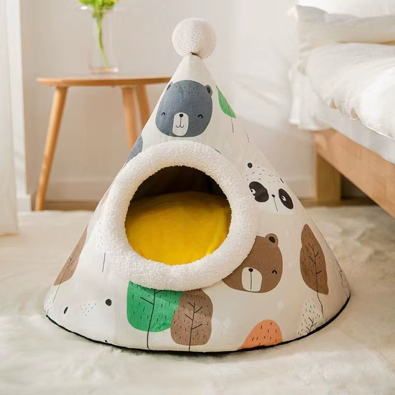 Small dog resting inside a grey cone-shaped enclosed pet tent bed in a home living room