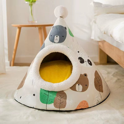 Small dog resting inside a grey cone-shaped enclosed pet tent bed in a home living room