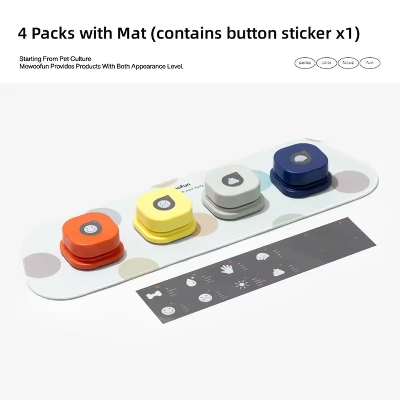 Four talking buttons in orange, yellow, cream, and navy arranged on the oval mat with packaging