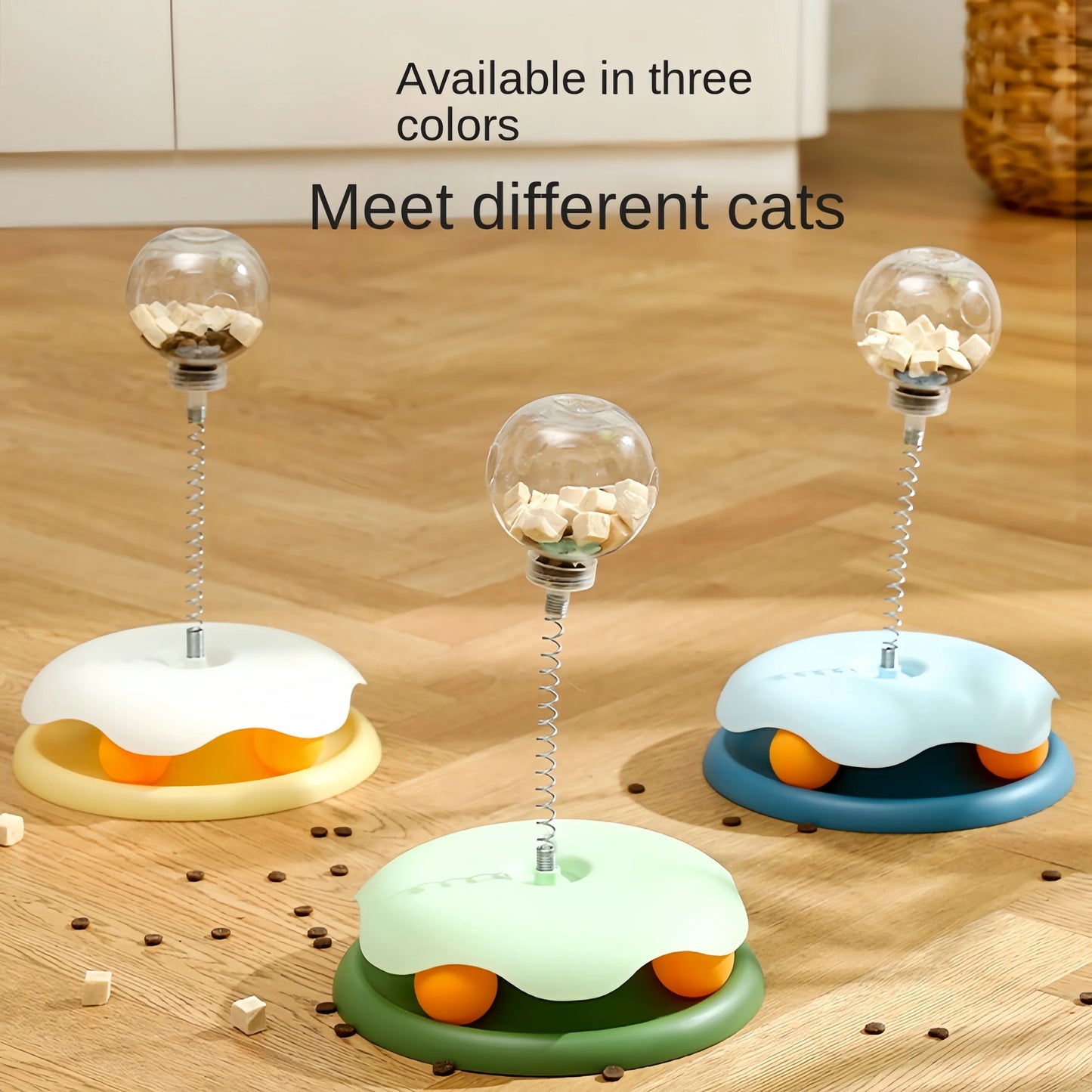 Three puzzle toy bases in yellow, blue, and green, each topped with a treat-filled clear ball