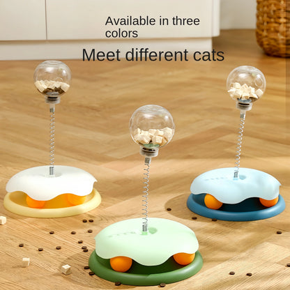 Three puzzle toy bases in yellow, blue, and green, each topped with a treat-filled clear ball