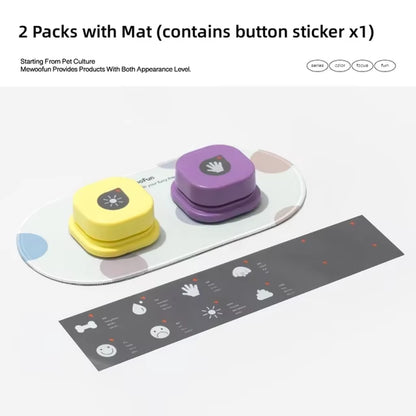 Yellow and purple talking buttons on an oval mat next to a black DIY label sticker sheet