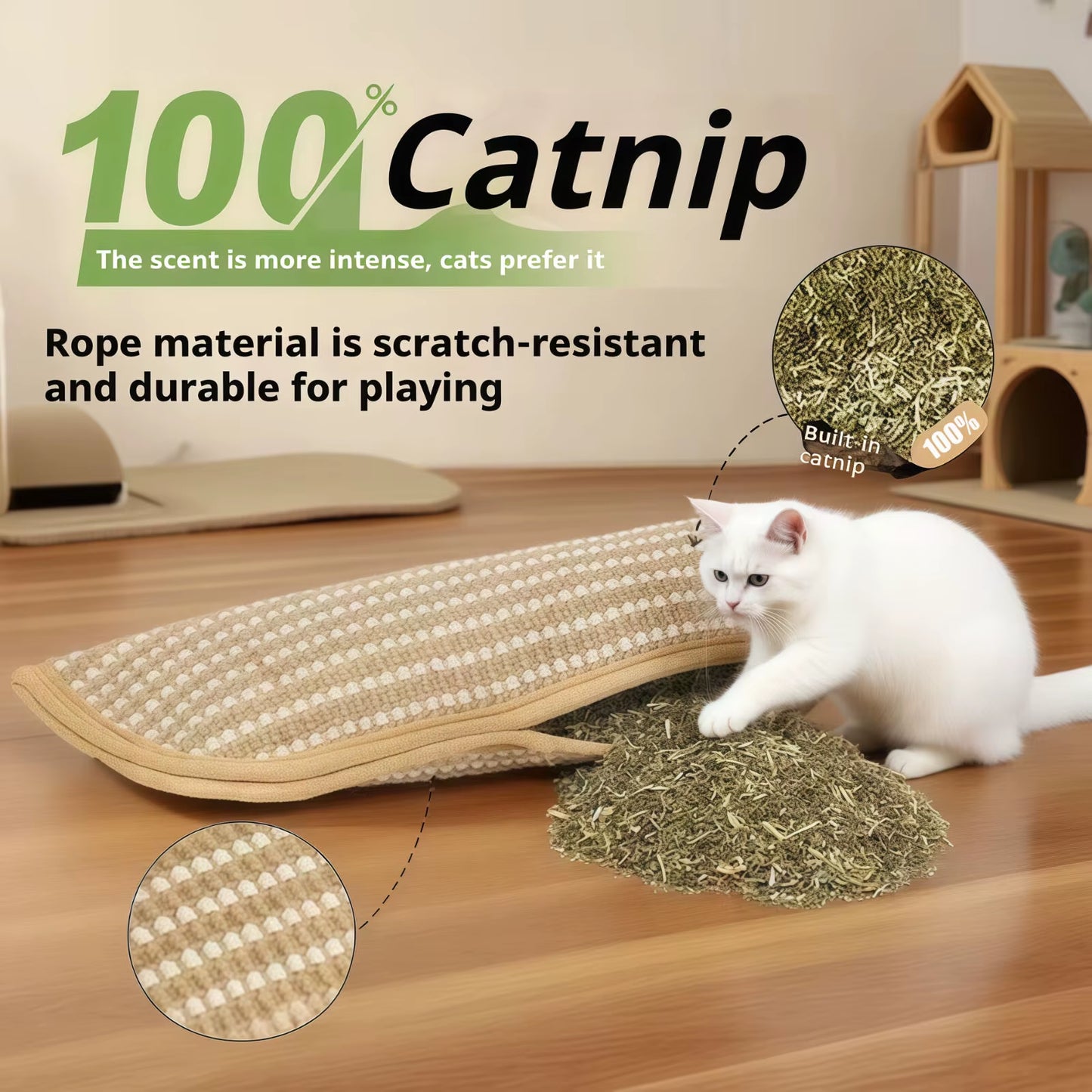 White kitten pawing at the catnip scratcher pad with a pile of loose catnip spilling from the seam