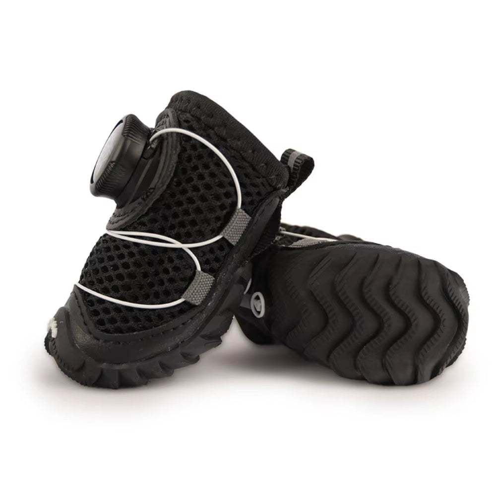 Close-up of the breathable mesh fabric texture and stitching on a dog shoe upper