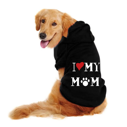 Golden Retriever wearing a black I Love My Mom hoodie with the hood up, seen from the side