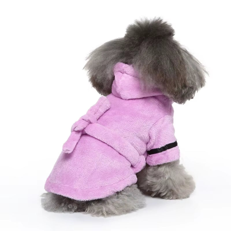 Gray plush hooded dog bathrobe laid flat with its belt tied in a bow at the waist